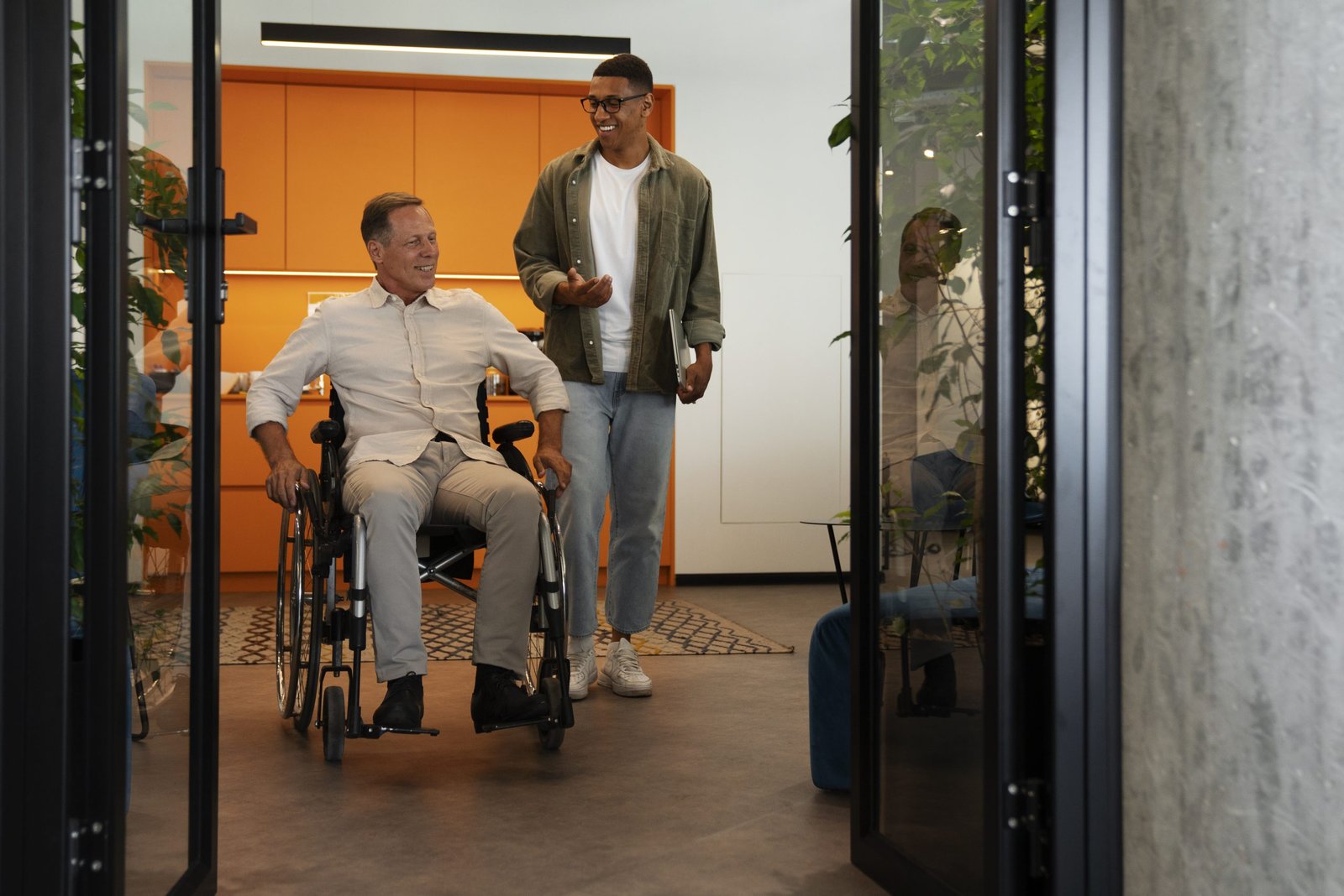 man-wheelchair-having-inclusive-office-job (3)
